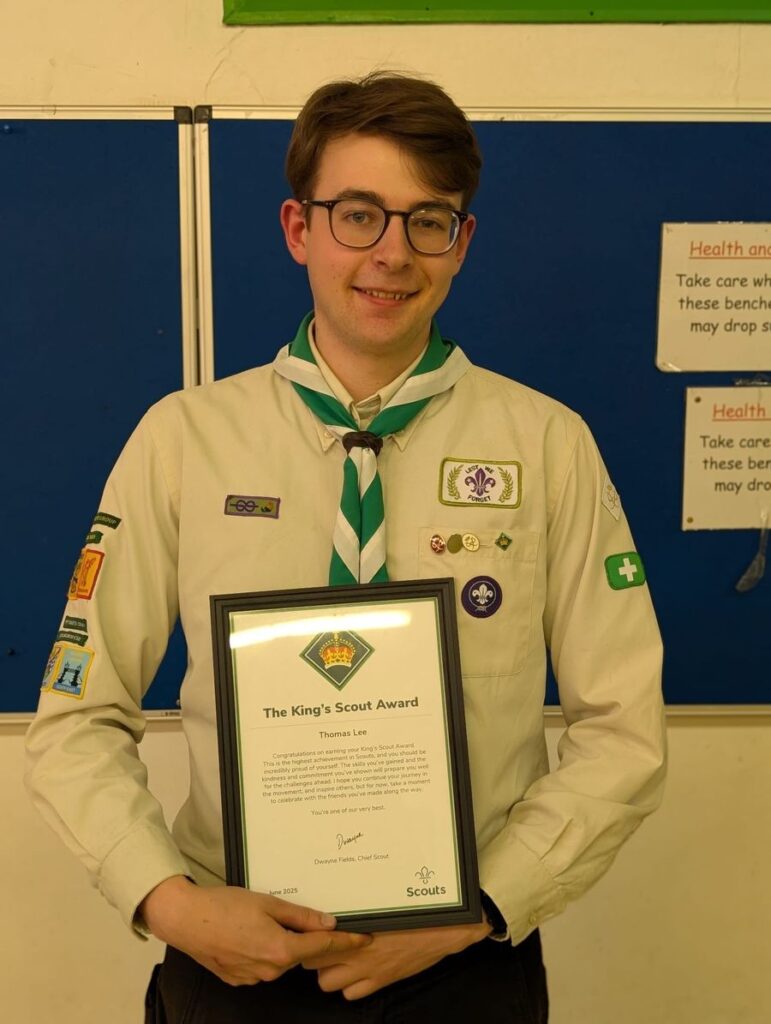 Tom Lee holding his King's Scout Award certificate