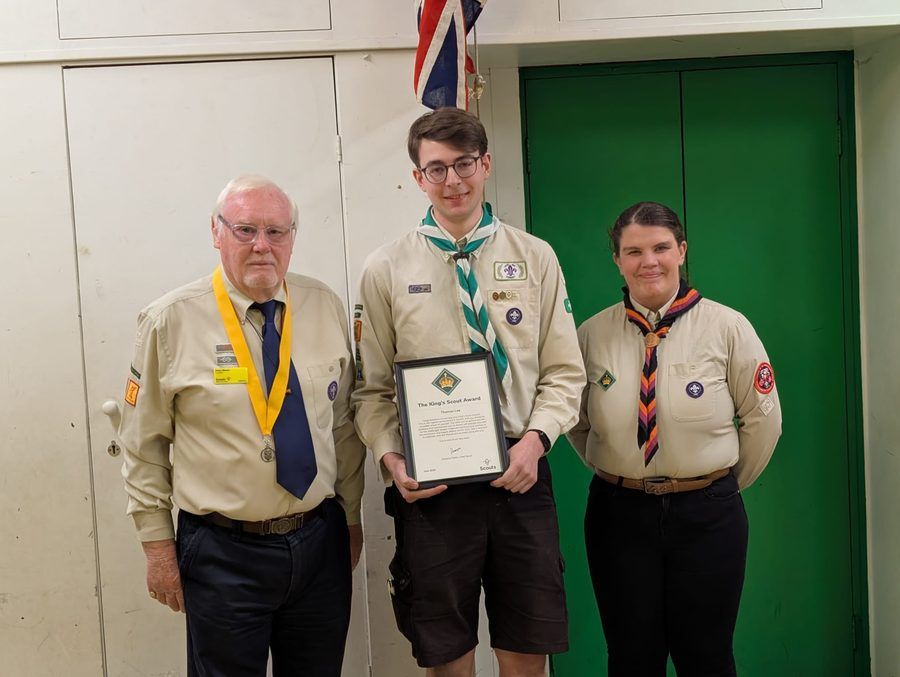 Tom Lee with two Flitwick Scout Group leaders at his King's Scout Award presentation
