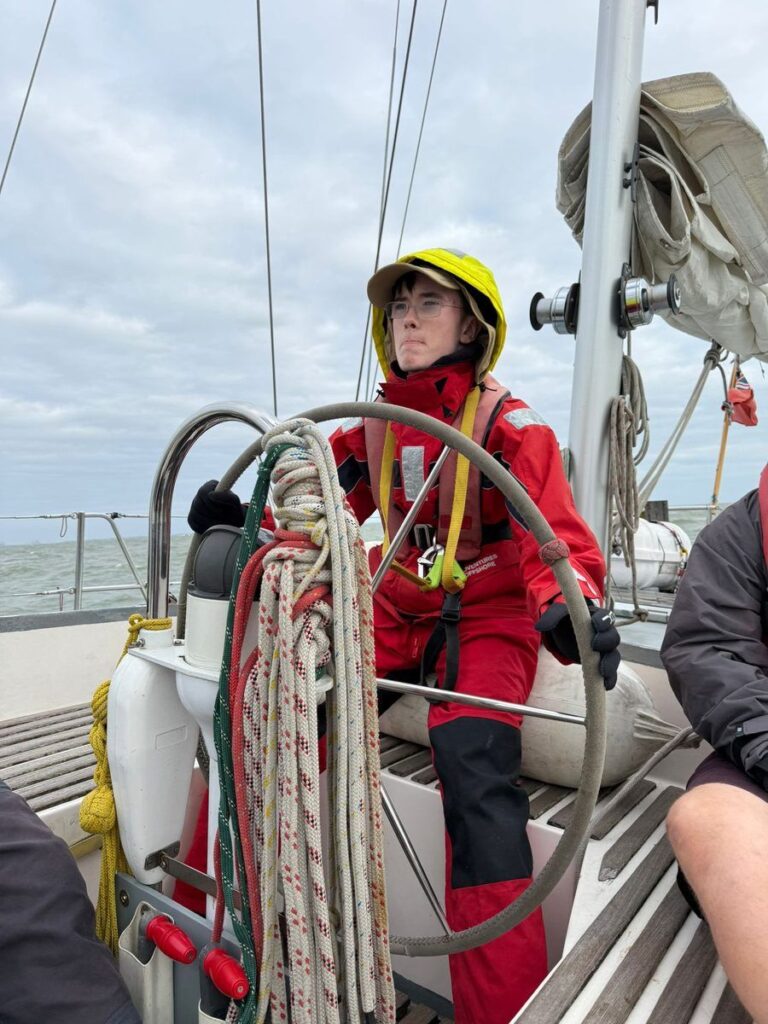 An Explorer Sea Scout at the helm during the North Sea crossing