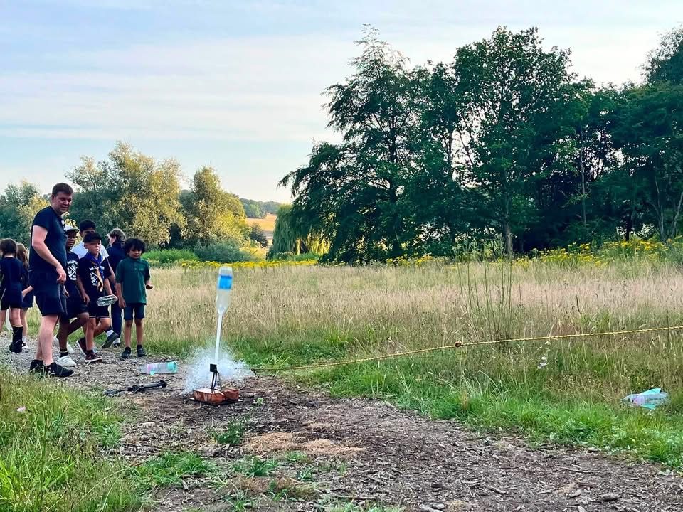 Beavers and Scouts watching a home-made bottle rocket launch at a First Luton Sea Scouts session