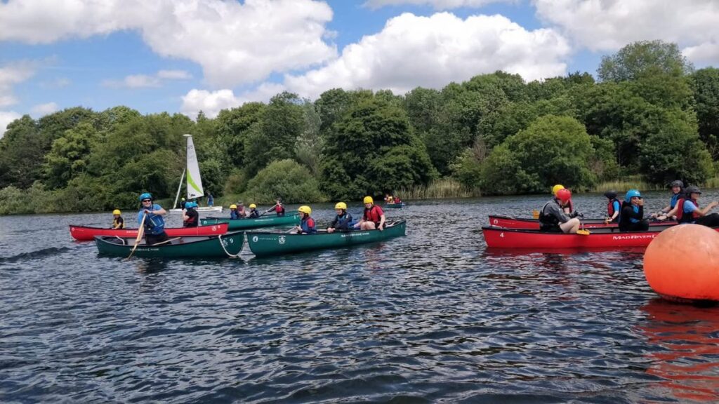 First Luton Sea Scouts canoeing and sailing together on the water