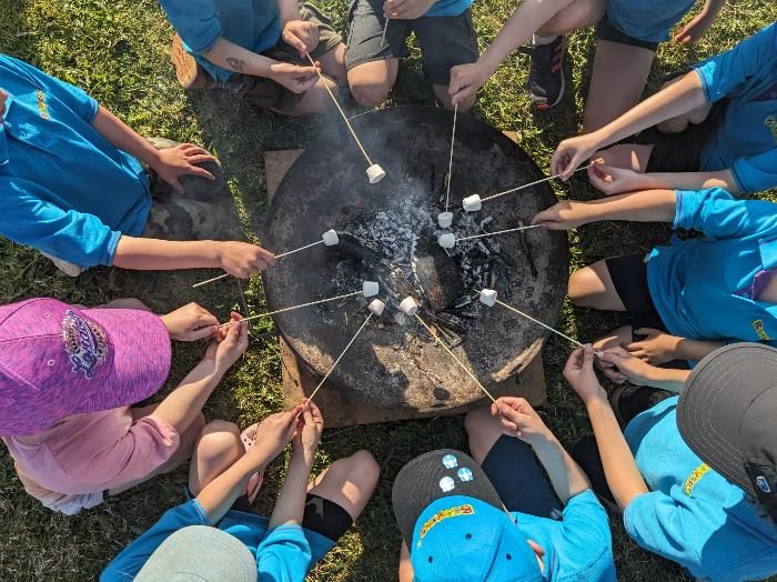 Flitwick Beavers toasting marshmallows around the campfire