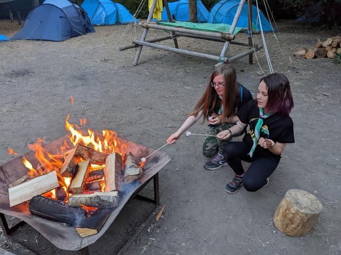 Flitwick Scouts toasting marshmallows at camp