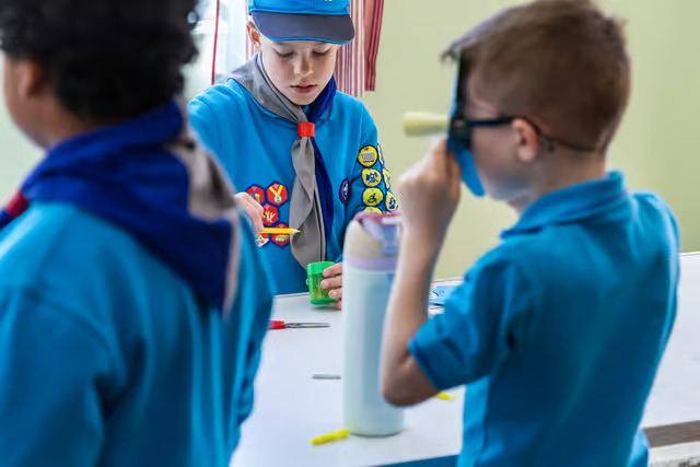 Young people at work on the morning's craft challenges