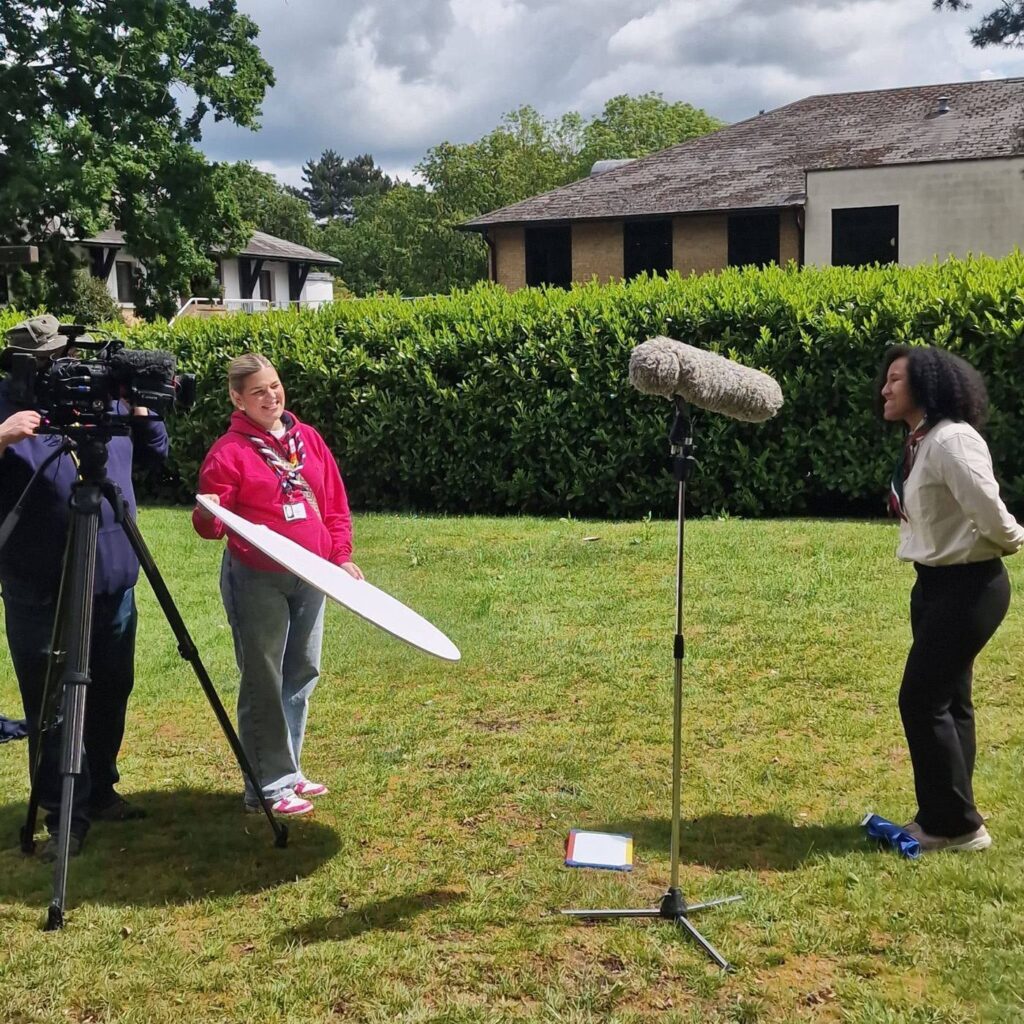 Anastacia is interviewed by a camera crew about the rescue